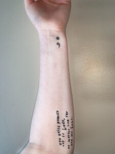Darcy's arm, showing her tattoos