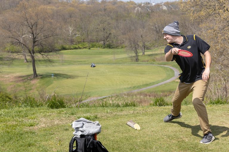 Quentin Borengasser, member of the Mizzou Disc Golf Club, plays the new course at AL Gustin