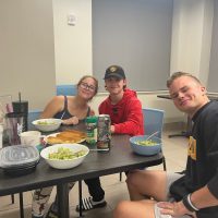 From left: Riley Schultze, Patrick O'Connor and Colby Unger enjoy a family-style meal. Karlea McCord/University of Missouri