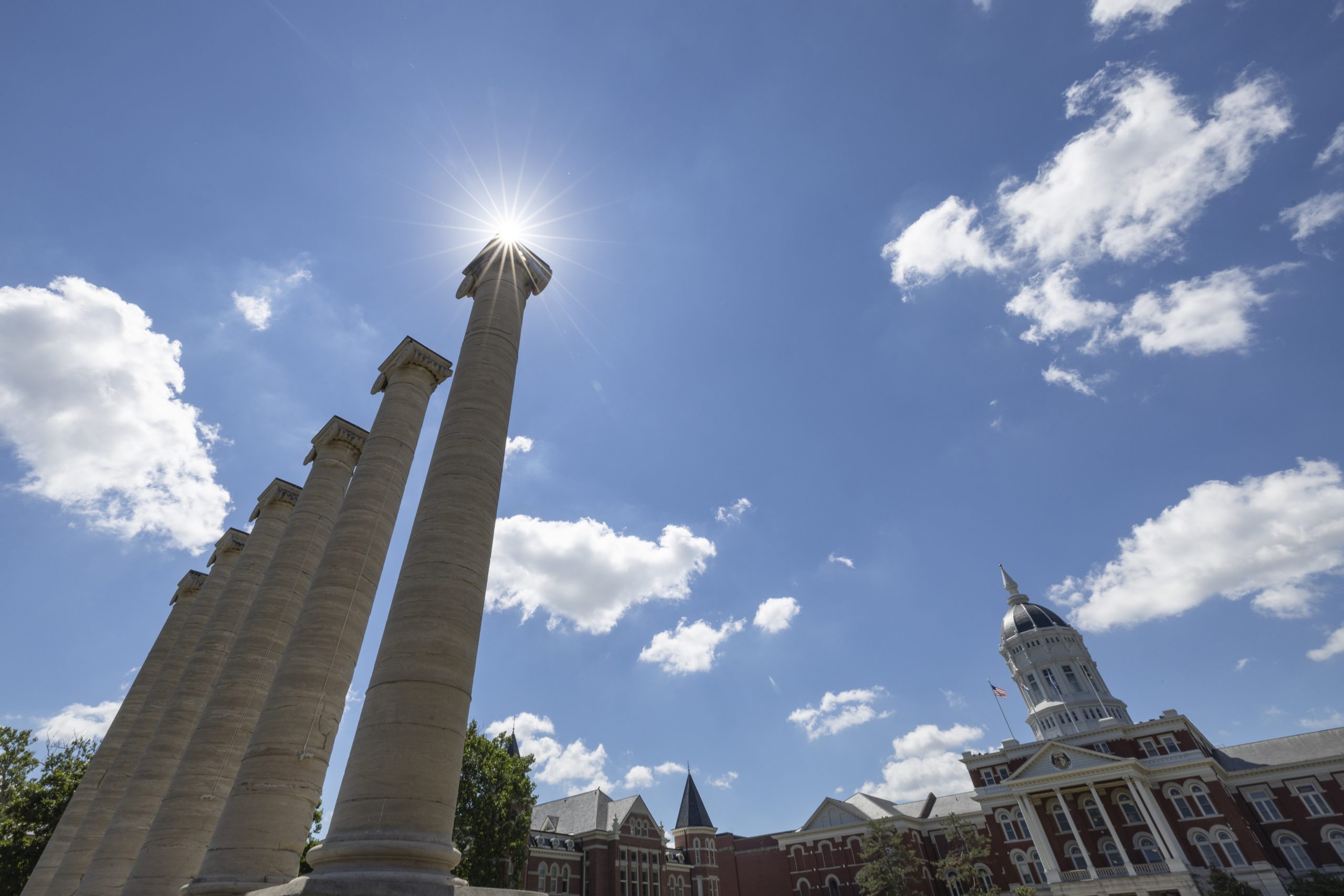 Summer clouds and sunshine over the columns