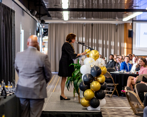 Leader speaking at event.