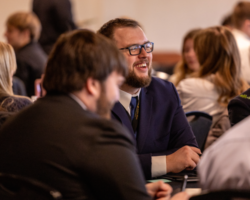 Student laughing and enjoying event.