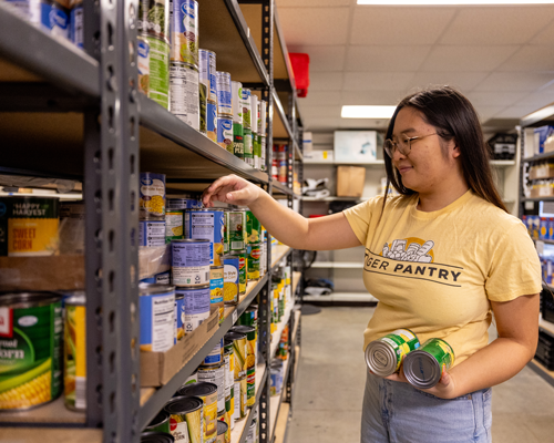 Student stocking Tiger Pantry.